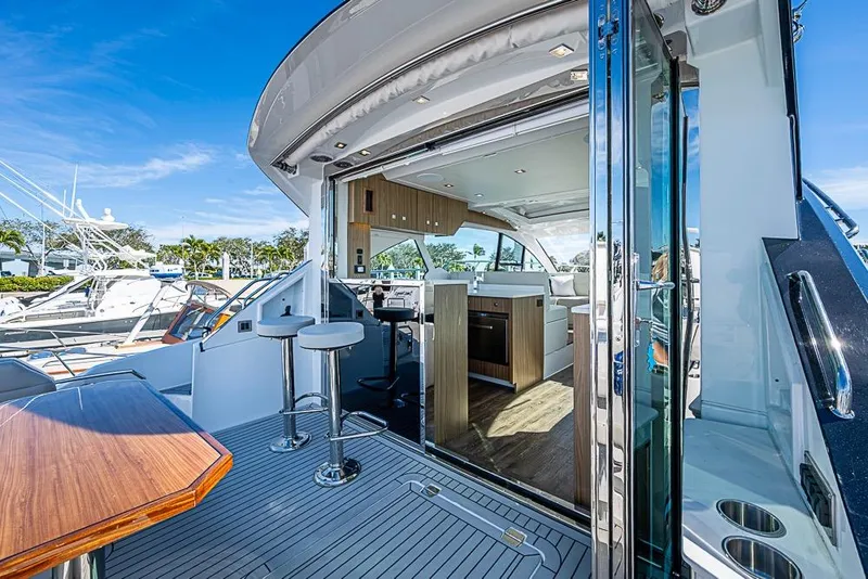 Slide: The Image of 2025 Cruisers Yachts 50 Cantius, luxurious interior with open deck and modern amenities. - 43
