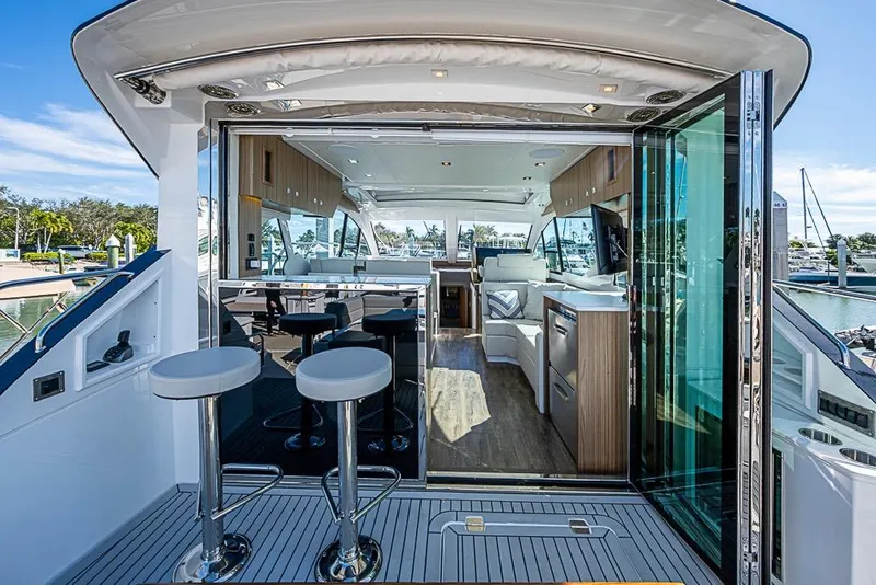 Slide: The Image of Luxurious 2025 Cruisers Yachts 50 Cantius interior with modern design and marina view. - 44