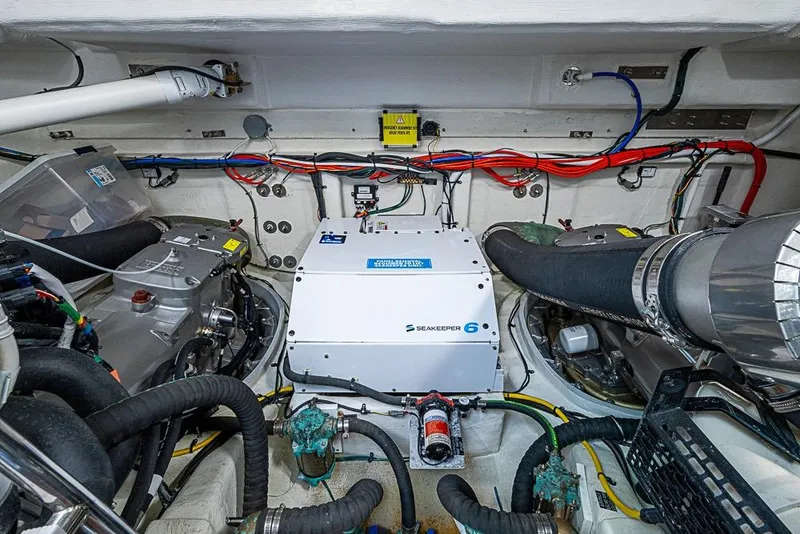 Slide: The Image of Engine room of 2025 Cruisers Yachts 50 Cantius with Seakeeper 6 stabilizer system. - 64