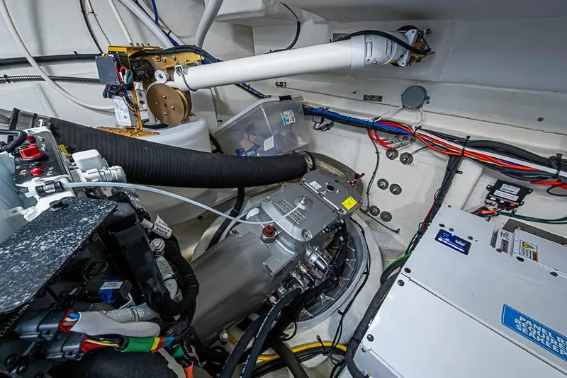 Slide: The Image of Engine room of 2025 Cruisers Yachts 50 Cantius, showcasing advanced mechanical systems and wiring. - 69