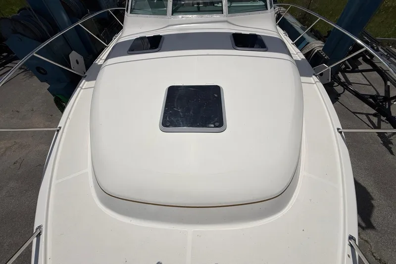 Slide: The Image of 1995 Tiara Yachts 3100 Open boat deck with hatches and railing. - 5