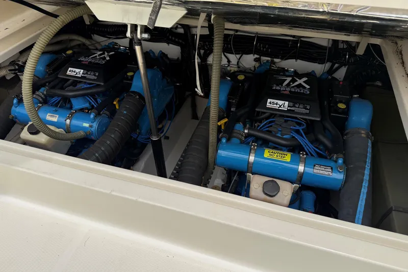 Slide: The Image of Engine compartment of a 1995 Tiara Yachts 3100 Open, featuring twin Crusader 454XL engines. - 27