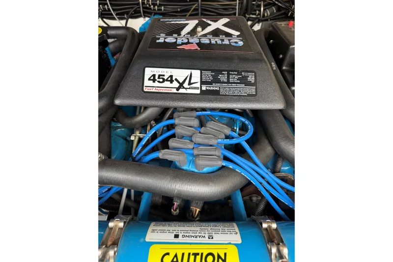 Slide: The Image of Engine compartment of a 1995 Tiara Yachts 3100 Open, featuring a Crusader 454XL engine. - 28