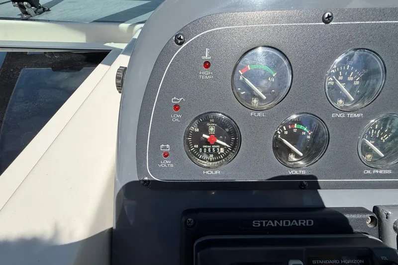 Slide: The Image of Instrument panel of a 1995 Tiara Yachts 3100 Open, displaying gauges and warning lights. - 18