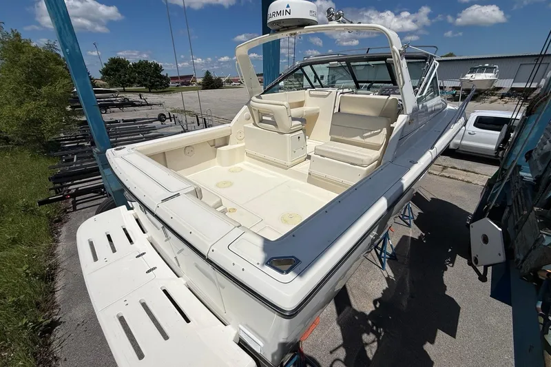 Slide: The Image of 1995 Tiara Yachts 3100 Open boat on a lift, sunny day, clear sky. - 10