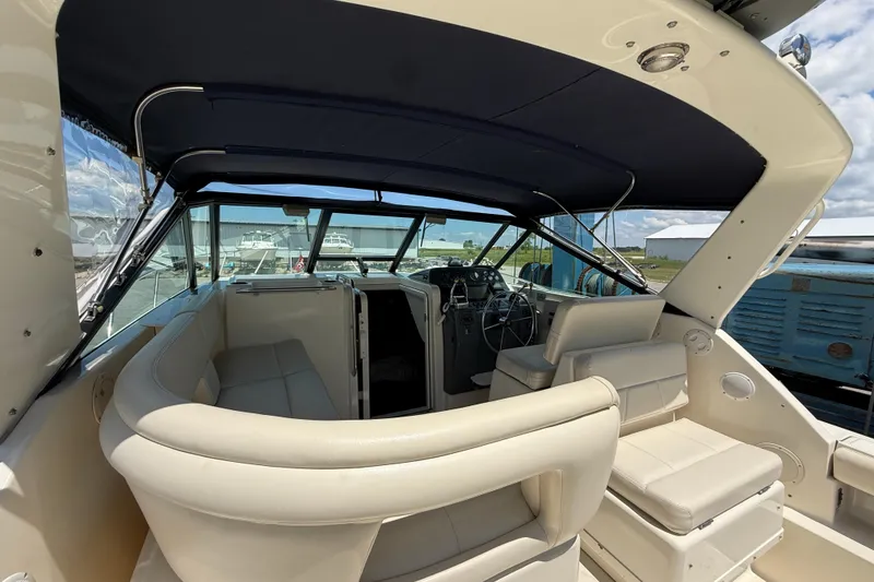 Slide: The Image of 1995 Tiara Yachts 3100 Open interior with seating and helm, showcasing luxury design. - 15