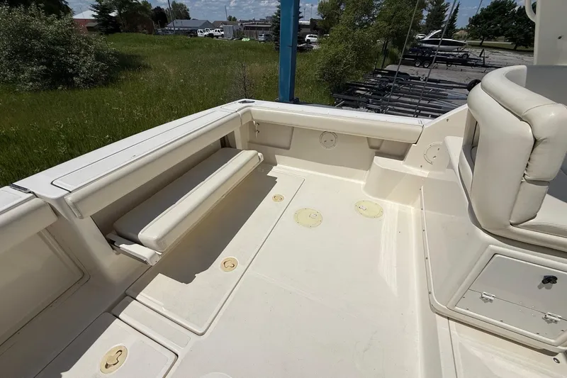 Slide: The Image of 1995 Tiara Yachts 3100 Open boat deck with seating and storage compartments. - 14