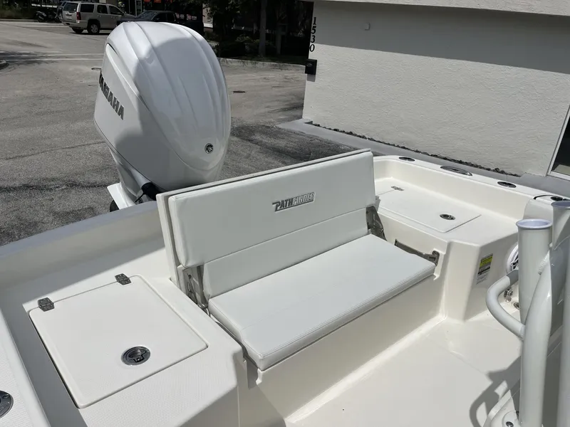 Slide: The Image of The image shows the stern of a Pathfinder 2400 Hybrid boat with a white outboard motor. - 25