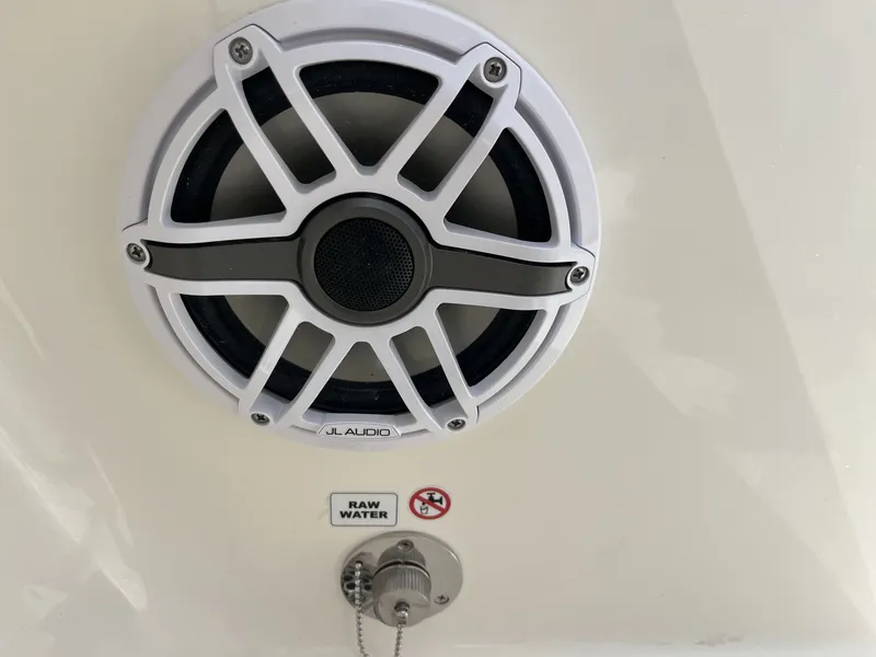 Slide: The Image of A speaker with a white grille and a "Raw Water" sticker below it. - 26