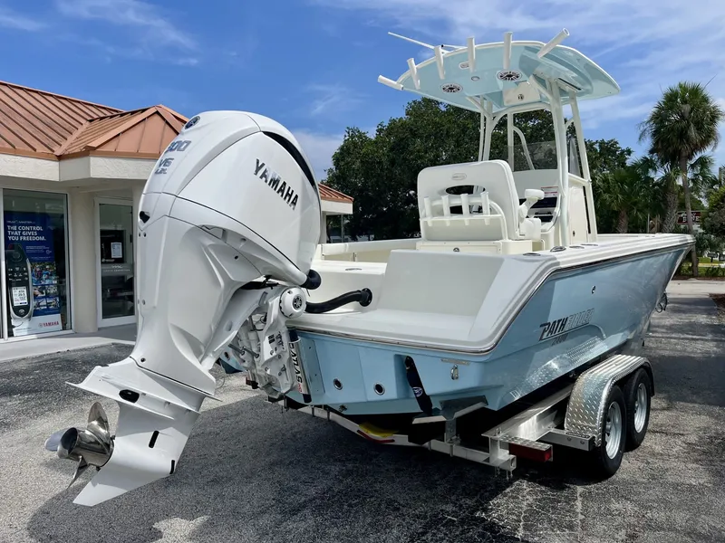 Slide: The Image of A modern Pathfinder 2400 Hybrid on a trailer in front of a building with palm trees in the background. - 5