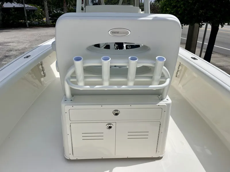 Slide: The Image of The image shows the cockpit of a Pathfinder 2400 Hybrid boat with rod holders and storage. - 10