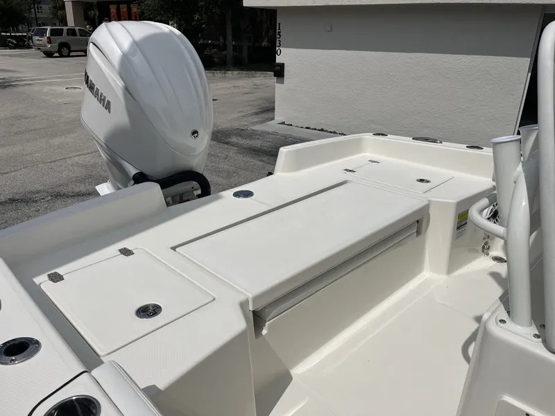 Slide: The Image of The image shows the stern of a Pathfinder 2400 Hybrid boat with an outboard motor. - 22