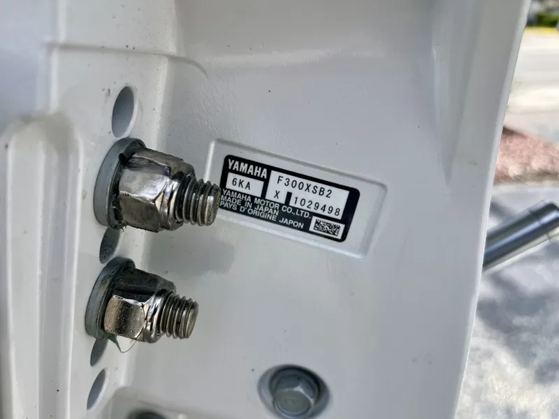 Slide: The Image of Close-up of a Yamaha engine plate with serial number and technical details. - 8