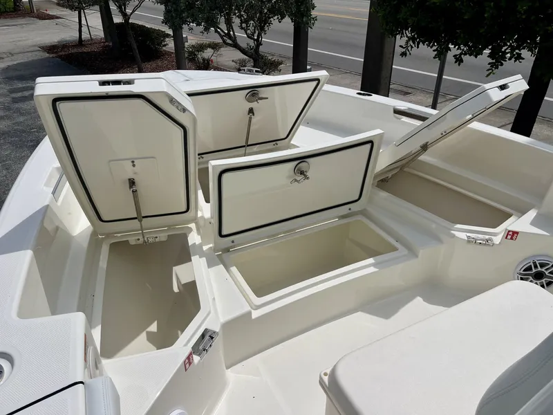 Slide: The Image of The 2027 Pathfinder 2400 Hybrid features multiple open storage compartments on the deck. - 16