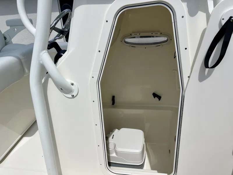 Slide: The Image of The image shows the interior of a boat cabin area with a small toilet. - 20