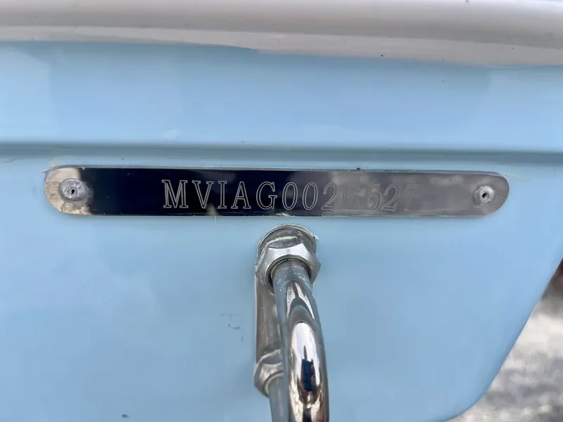 Slide: The Image of Close-up of a boat hull with a metal plaque and engraving. - 7