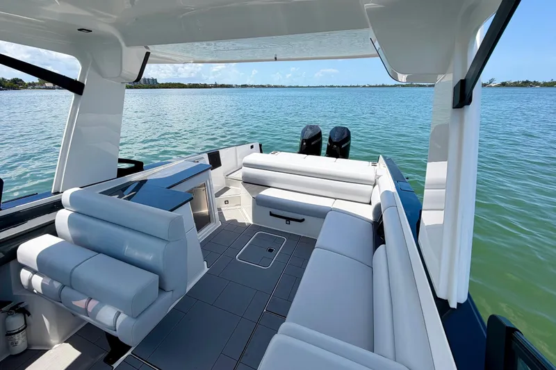 Slide: The Image of Luxurious 2022 Aviara AV32 OB boat interior with spacious seating and scenic water view. - 14