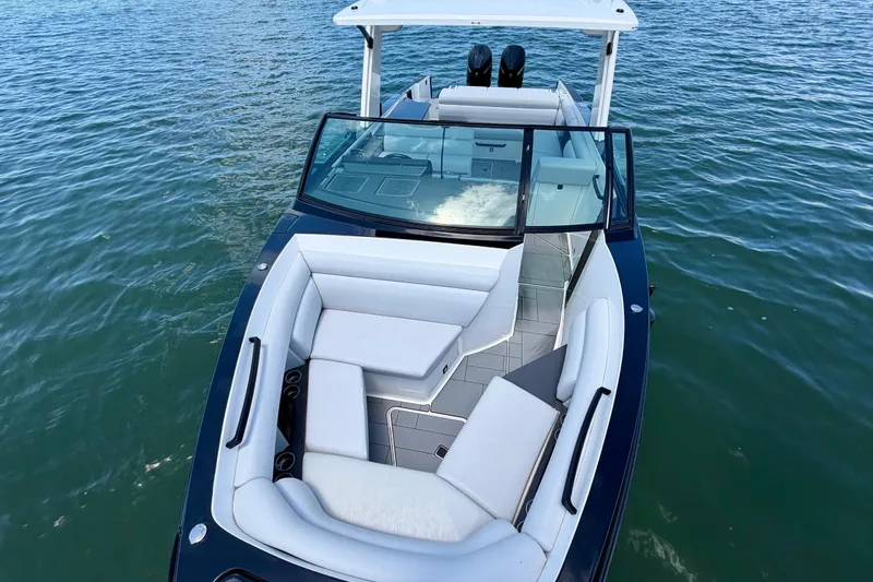 Slide: The Image of 2022 Aviara AV32 OB boat with sleek design and spacious seating on the water. - 21