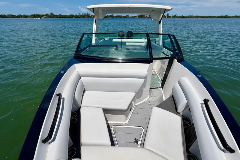 Slide: The Image of 2022 Aviara AV32 OB boat with sleek seating on calm water. - 23