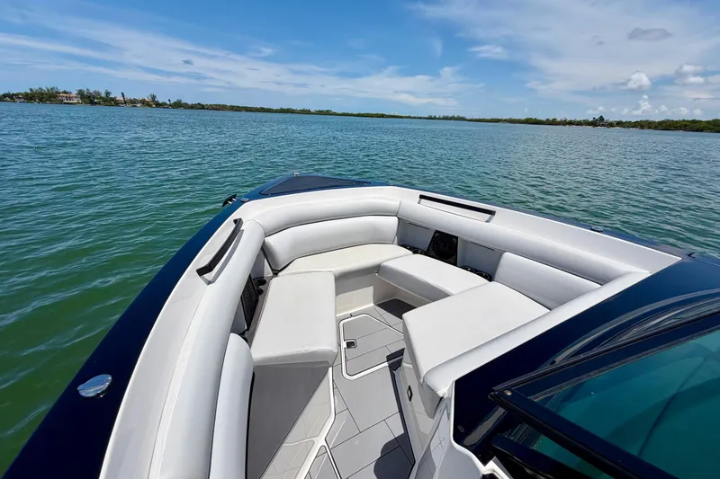 Slide: The Image of 2022 Aviara AV32 OB boat with spacious seating on calm water. - 24
