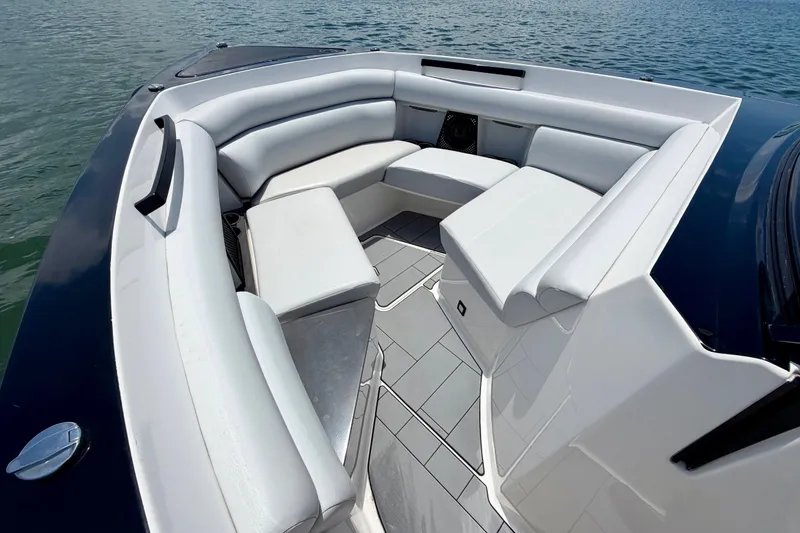 Slide: The Image of Luxurious seating area on 2022 Aviara AV32 OB boat, featuring sleek design and comfortable upholstery. - 25