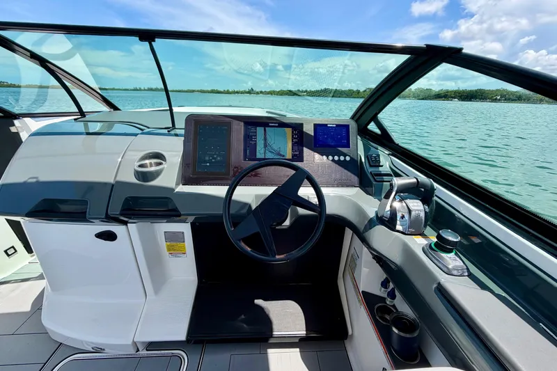 Slide: The Image of Cockpit view of 2022 Aviara AV32 OB boat with modern navigation system and controls. - 31