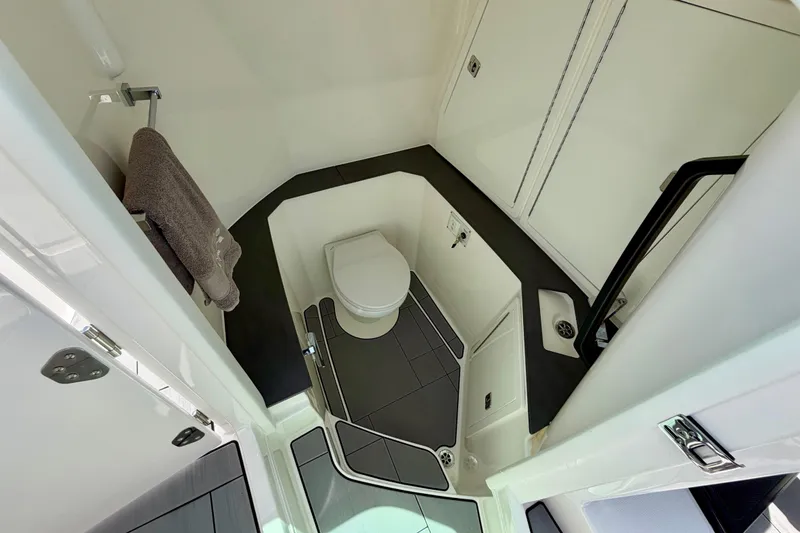 Slide: The Image of Luxurious bathroom interior of 2022 Aviara AV32 OB boat, featuring modern fixtures and sleek design. - 35