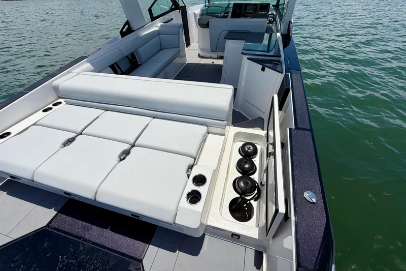 Slide: The Image of 2022 Aviara AV32 OB boat with spacious seating and sleek design on the water. - 38