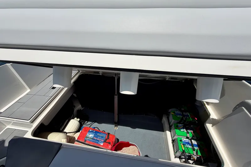 Slide: The Image of 2022 Aviara AV32 OB boat storage compartment with batteries and equipment. - 42