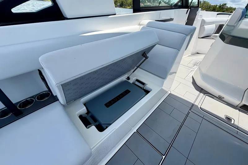 Slide: The Image of 2022 Aviara AV32 OB boat interior with sleek seating and integrated storage compartment. - 44
