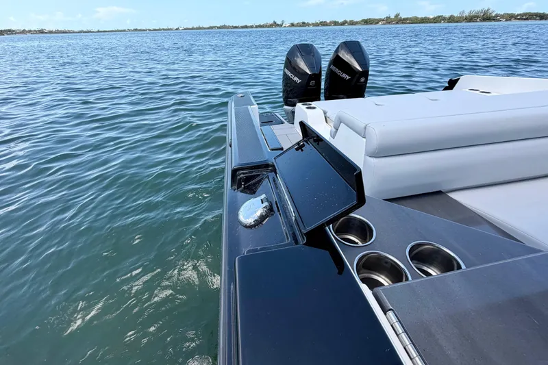 Slide: The Image of 2022 Aviara AV32 OB boat with dual Mercury engines on a calm lake. - 48