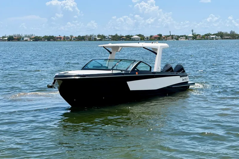 Slide: The Image of 2022 Aviara AV32 OB boat cruising on a sunny day in calm waters. - 7