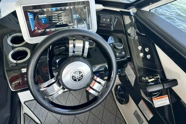 Slide: The Image of 2021 Yamaha Boats 275SD helm with touchscreen display and modern controls. - 14