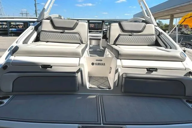 Slide: The Image of 2021 Yamaha Boats 275SD interior with luxurious seating and sleek design. - 21