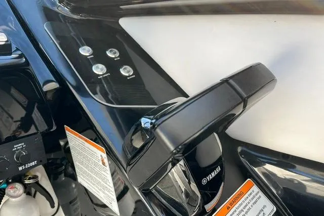Slide: The Image of Close-up of 2021 Yamaha Boats 275SD control panel and throttle handle. - 29