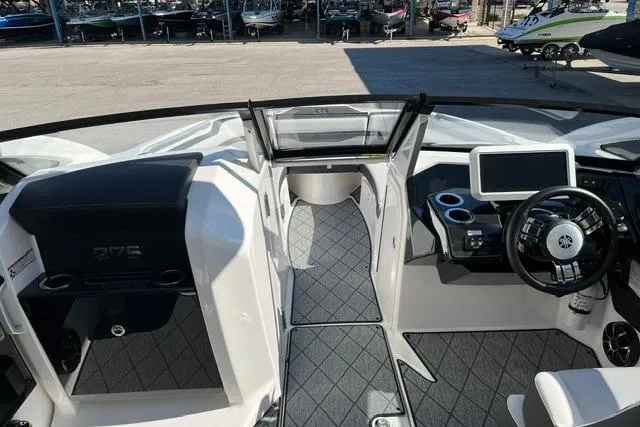 Slide: The Image of 2021 Yamaha Boats 275SD interior with modern dashboard and seating. - 32