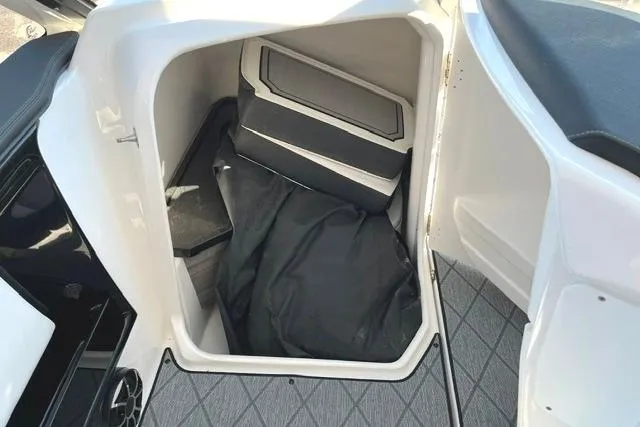 Slide: The Image of Storage compartment in 2021 Yamaha Boats 275SD, featuring spacious interior and sleek design. - 34