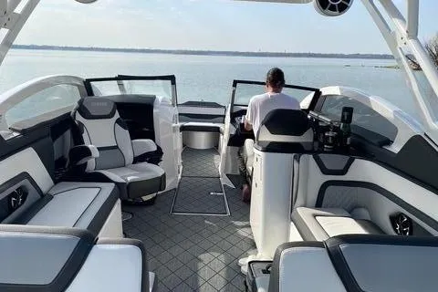 Slide: The Image of 2021 Yamaha 275SD on calm water with luxurious, modern interior. - 5