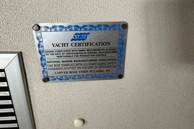 Slide: The Image of Yacht certification plaque on 1989 Carver 32 Aft Cabin Motor Yacht, NMMA compliance. - 26