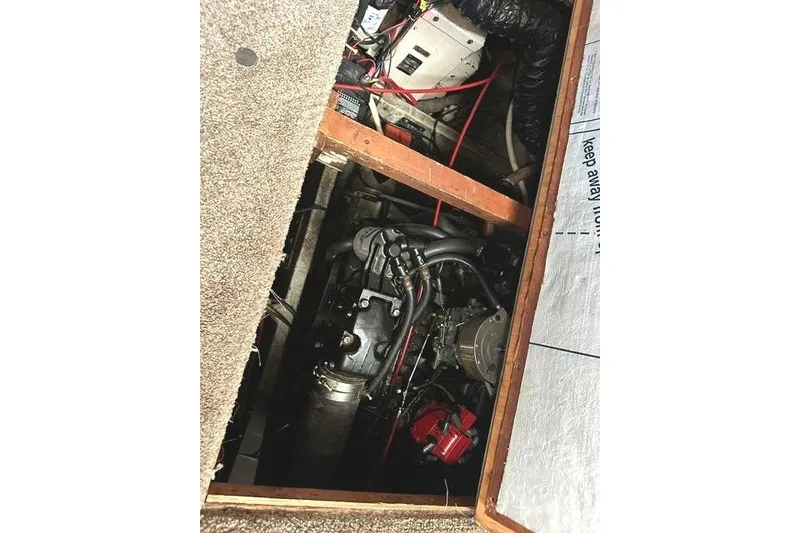 Slide: The Image of Engine compartment of 1989 Carver 32 Aft Cabin Motor Yacht, showing mechanical components. - 27