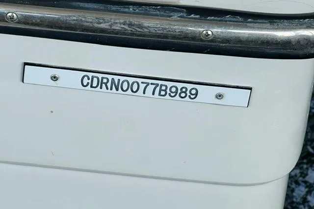 Slide: The Image of 1989 Carver 32 Aft Cabin Motor Yacht hull identification number plate. - 33