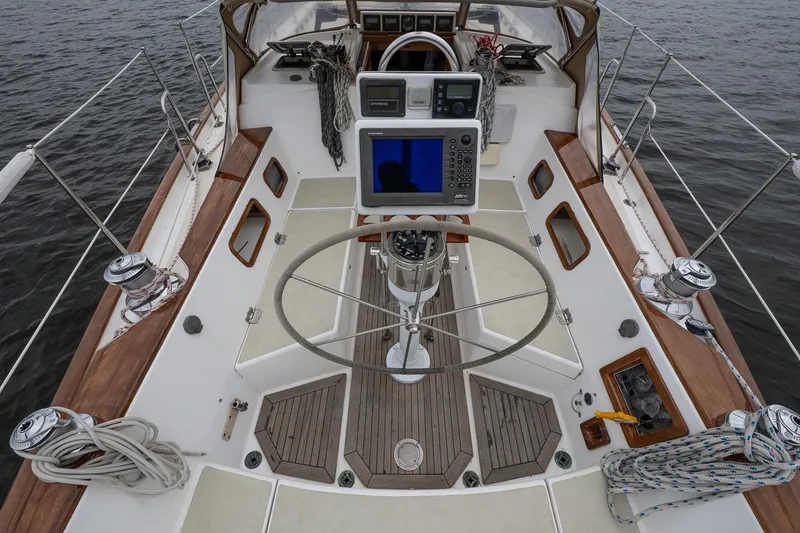 Slide: The Image of Cockpit of 1992 Morris Ocean Series 44 sailboat with navigation equipment and wooden accents. - 18
