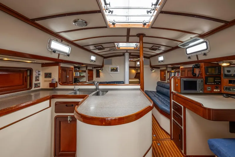 Slide: The Image of Luxurious 1992 Morris Ocean Series 44 yacht interior with elegant wood finishes and modern amenities. - 24