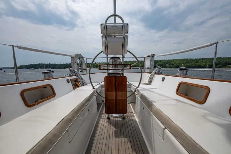 Slide: The Image of Cockpit view of 1992 Morris Ocean Series 44 sailboat with scenic water backdrop. - 56