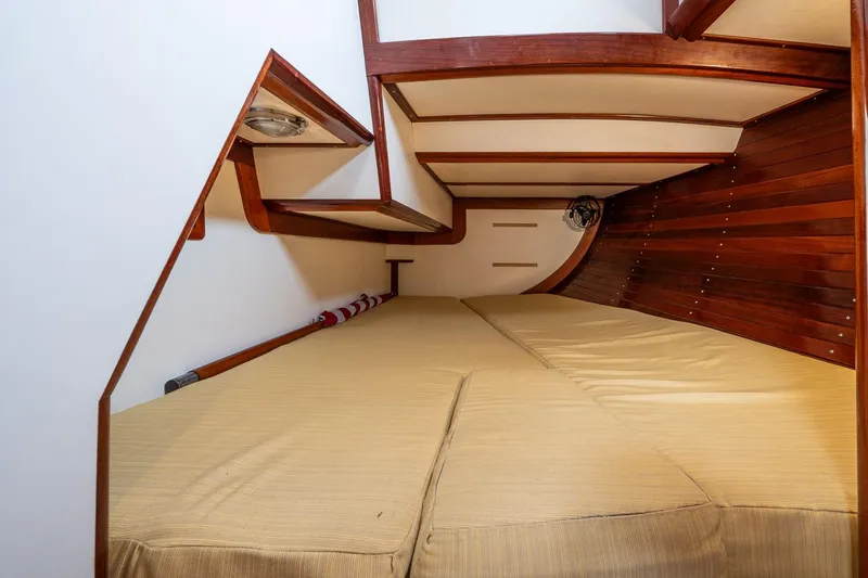 Slide: The Image of Interior cabin of 1992 Morris Ocean Series 44 yacht with wooden accents and beige bedding. - 43