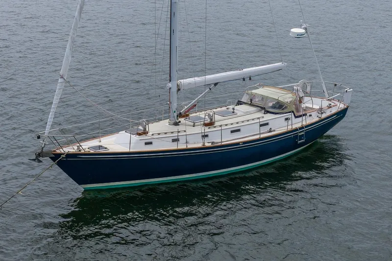 Slide: The Image of Sailboat Morris Ocean Series 44, 1992 model, anchored on calm water. - 3