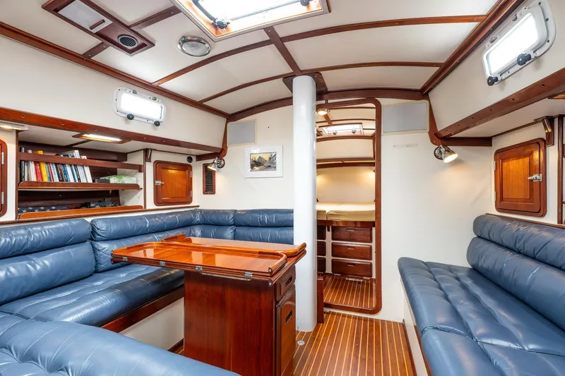 Slide: The Image of Luxurious interior of 1992 Morris Ocean Series 44 yacht with blue leather seating and wooden accents. - 31