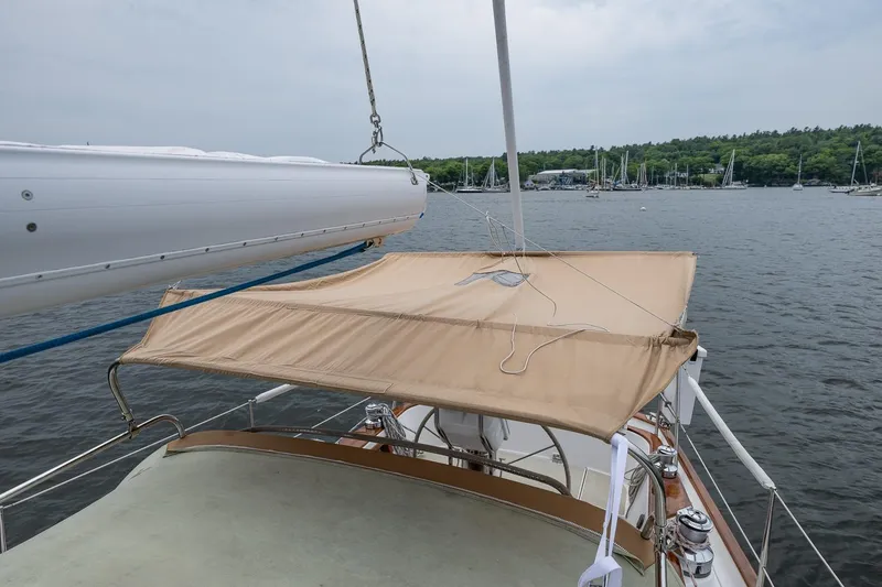 Slide: The Image of Sailboat Morris Ocean Series 44, 1992 model, anchored in a scenic harbor. - 59