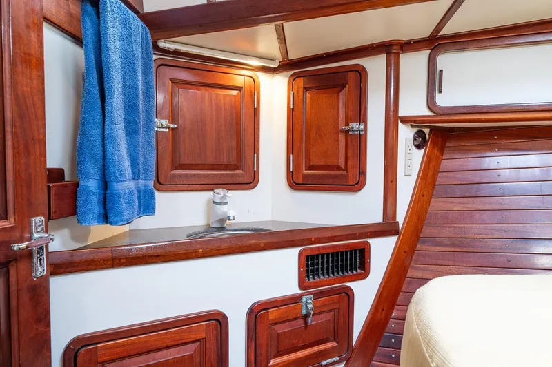 Slide: The Image of Interior of 1992 Morris Ocean Series 44 yacht with wooden cabinetry and blue towel. - 36