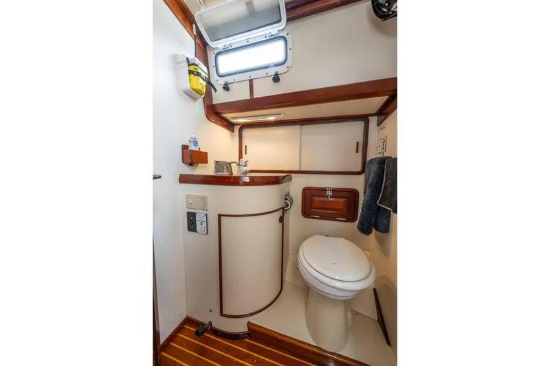Slide: The Image of Interior of 1992 Morris Ocean Series 44 yacht bathroom with wooden accents and compact design. - 47